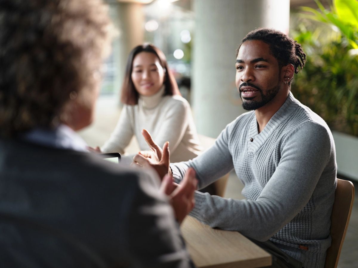 A couple discussing their plans with an advisor